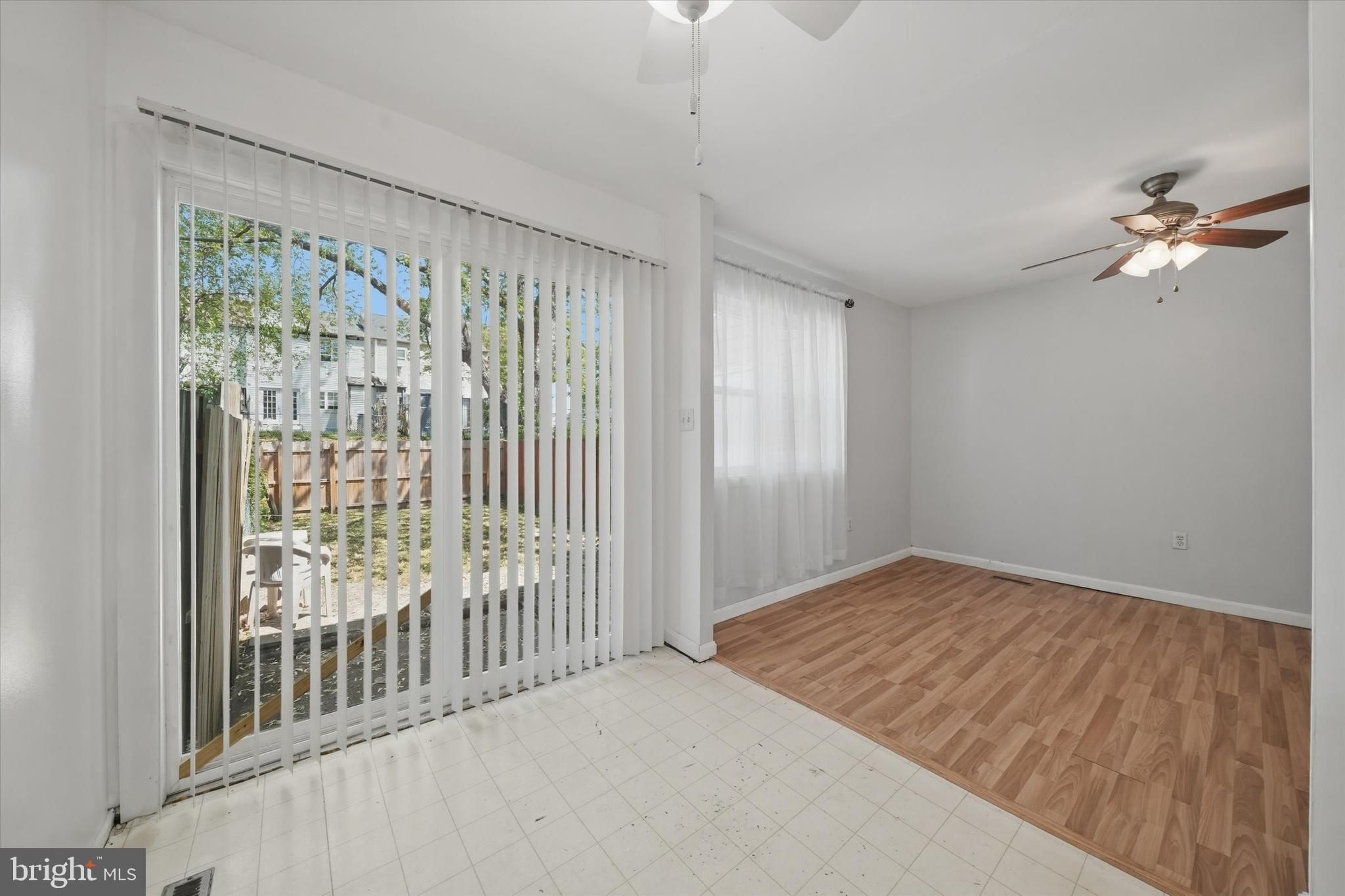 125 Elliot Street Newark, DE 19713 - Photo 11 of 32 a view of a bedroom with wooden floor and a chandelier fan