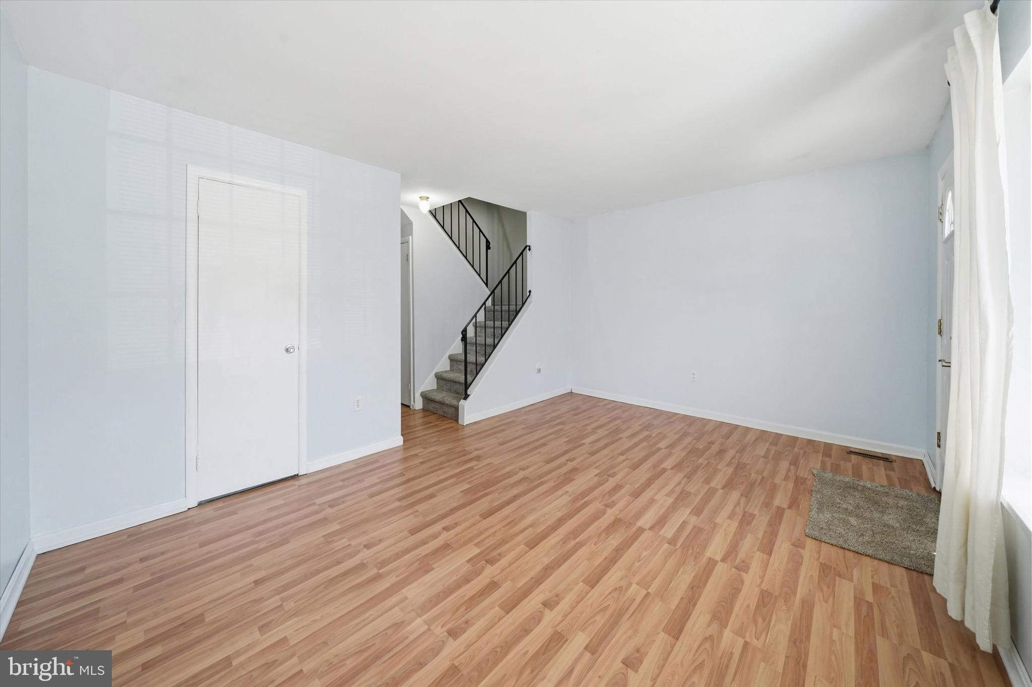 125 Elliot Street Newark, DE 19713 - Photo 6 of 32 a view of empty room with wooden floor
