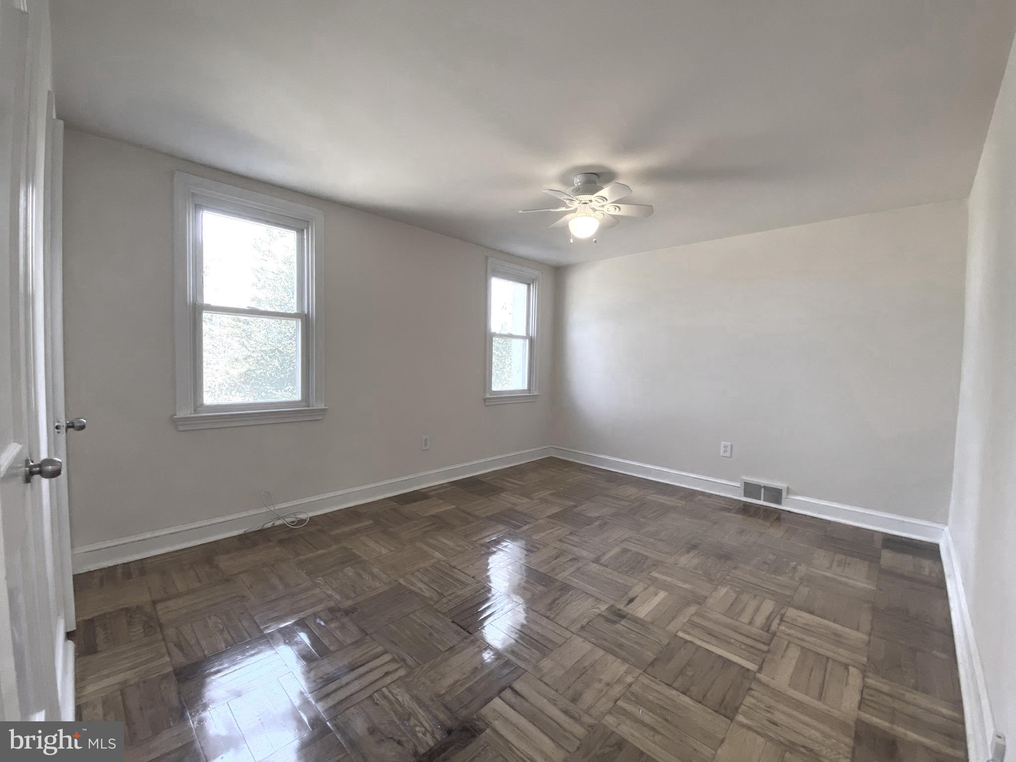 19 Woodhill Road Willow Grove, PA 19090 - Photo 11 of 24 an empty room with windows and chandelier fan