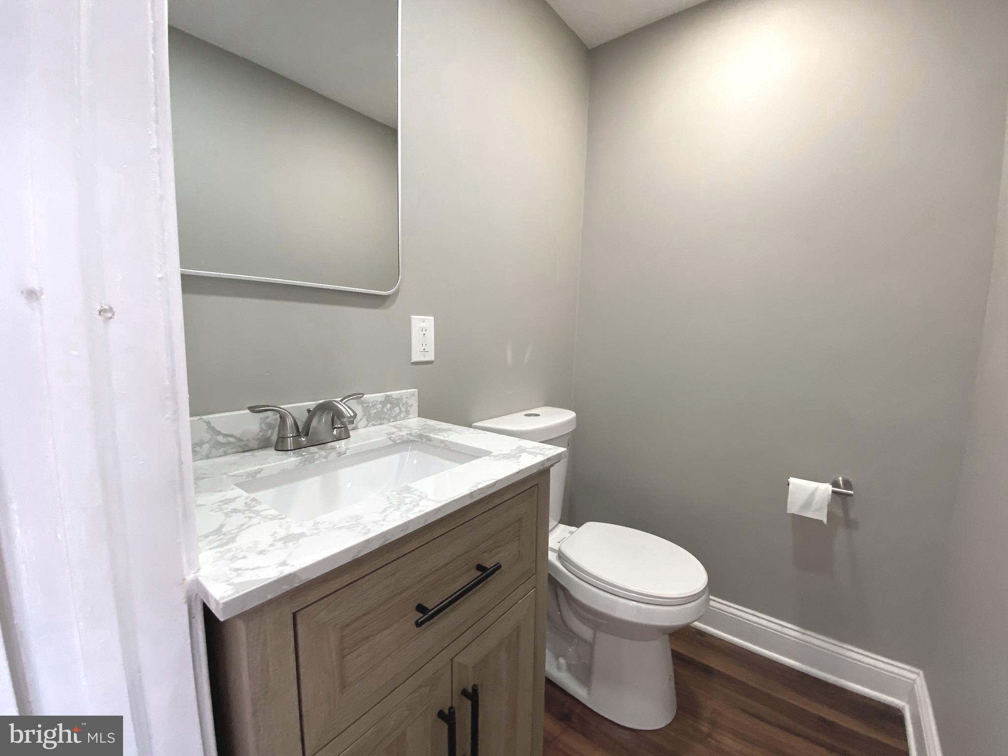 19 Woodhill Road Willow Grove, PA 19090 - Photo 12 of 24 a bathroom with a granite countertop sink and a toilet