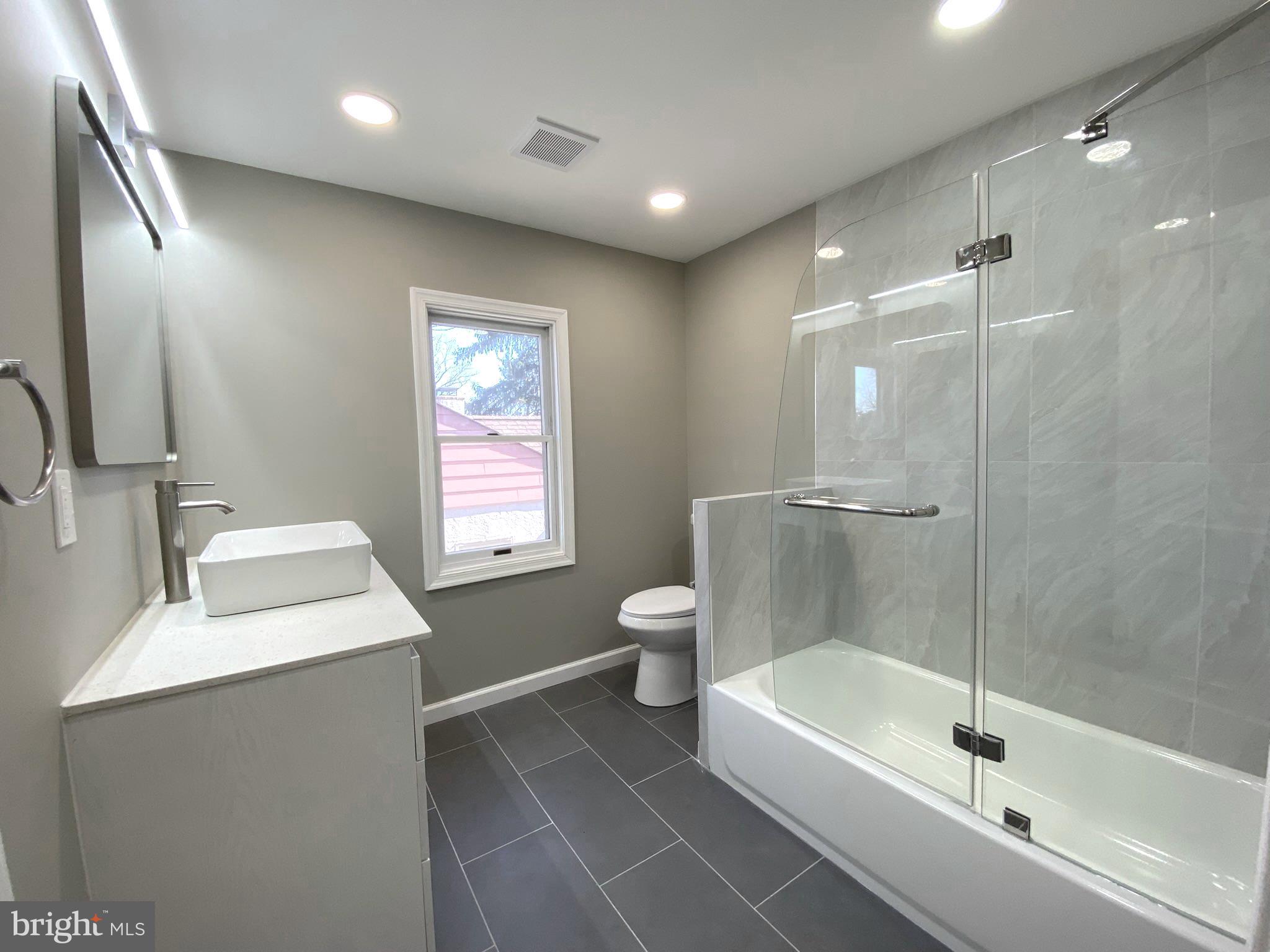 19 Woodhill Road Willow Grove, PA 19090 - Photo 15 of 24 a bathroom with a granite countertop sink a toilet and shower