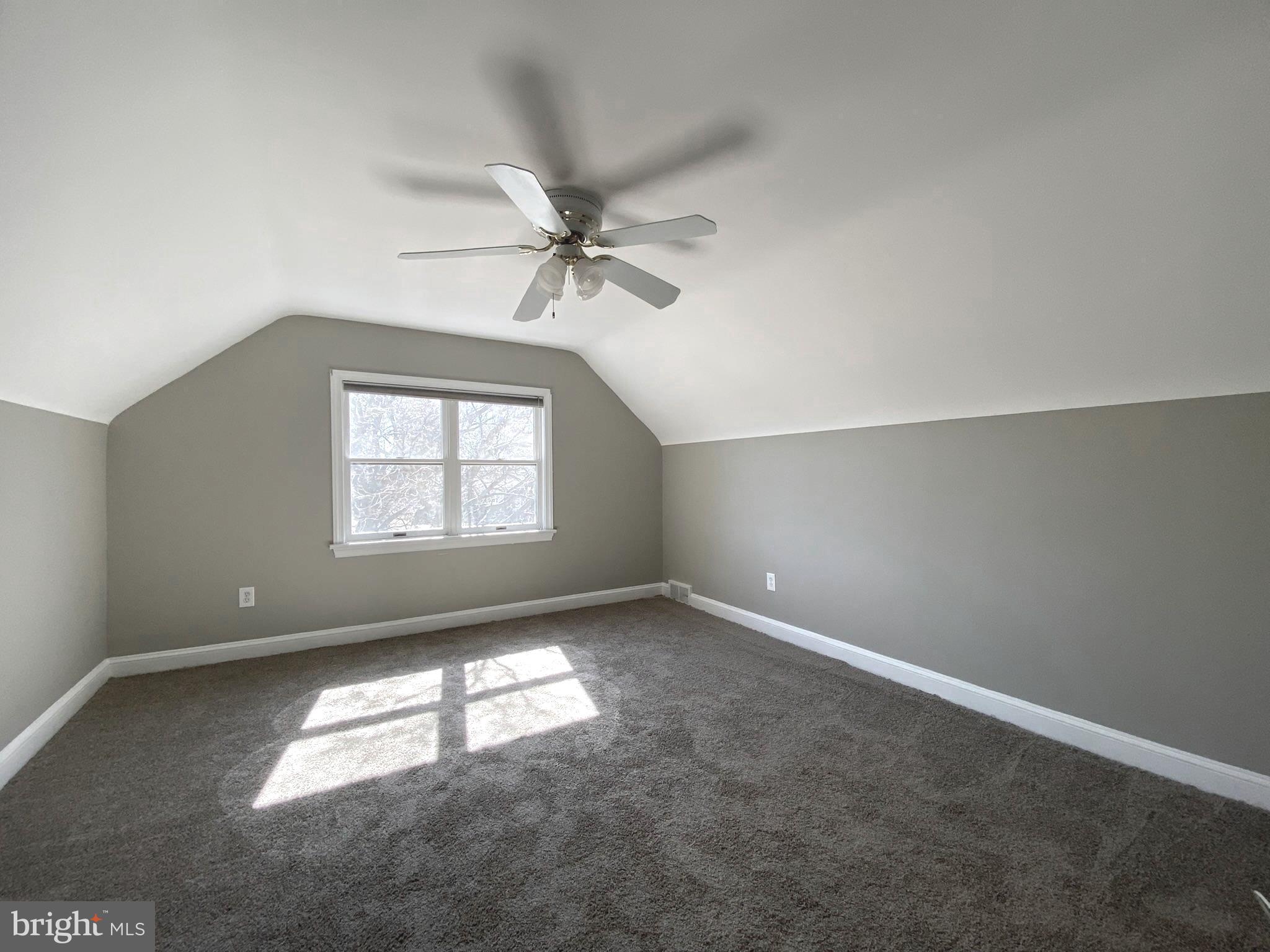 19 Woodhill Road Willow Grove, PA 19090 - Photo 18 of 24 an empty room with a window and a ceiling fan