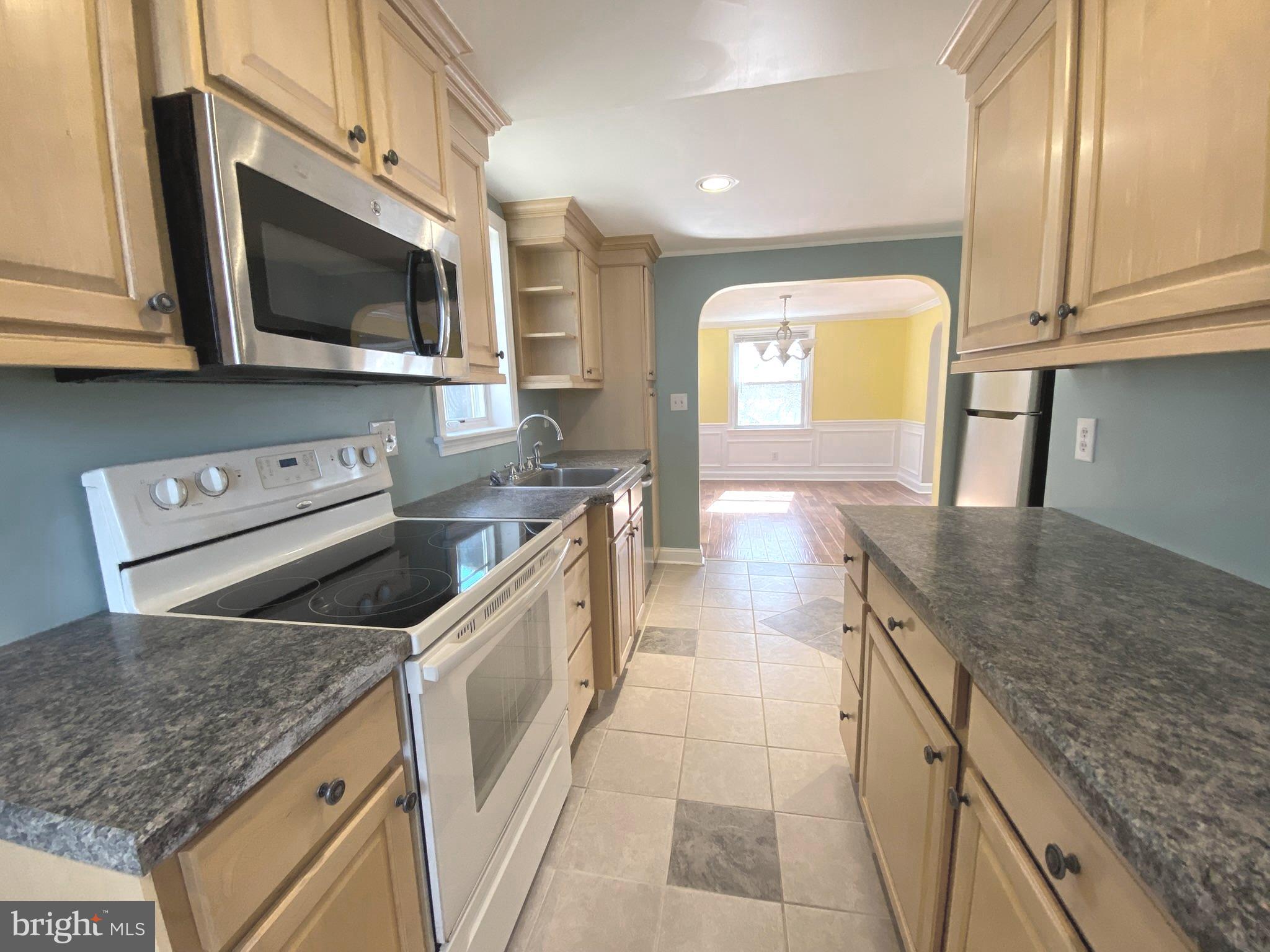 19 Woodhill Road Willow Grove, PA 19090 - Photo 7 of 24 a kitchen with stainless steel appliances granite countertop a sink and a microwave