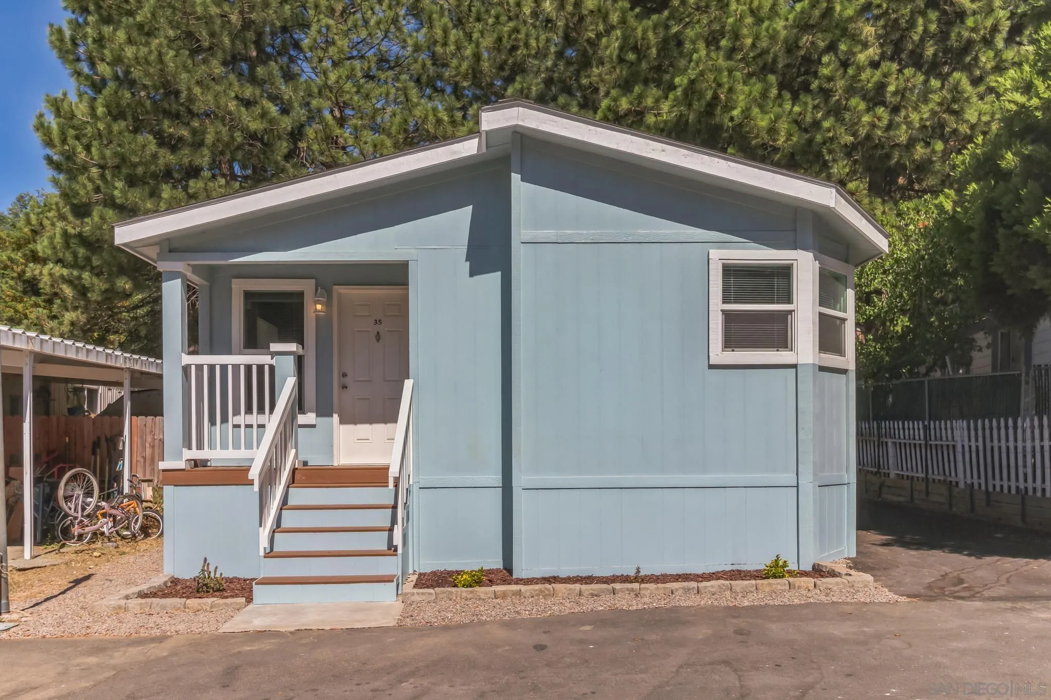 a view of a house with a small yard