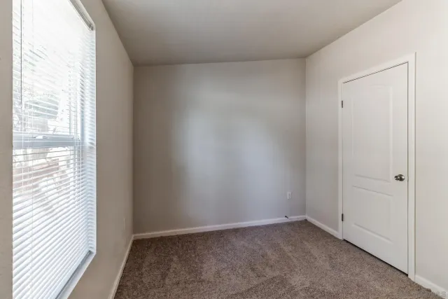 a view of an empty room and window