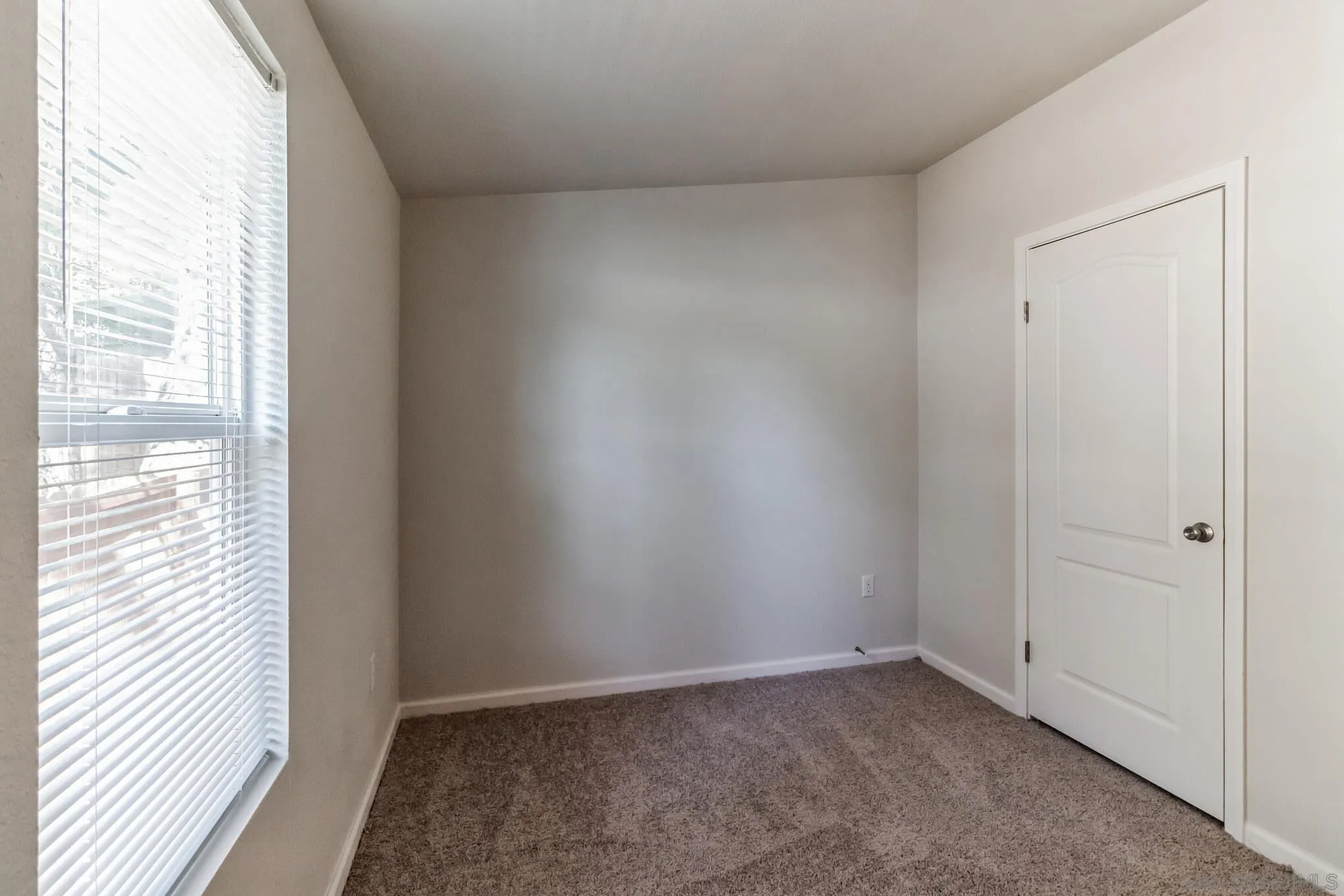 22899 Byron Road, Unit 35 Crestline, CA 92325 - Photo 11 of 18 a view of an empty room and window