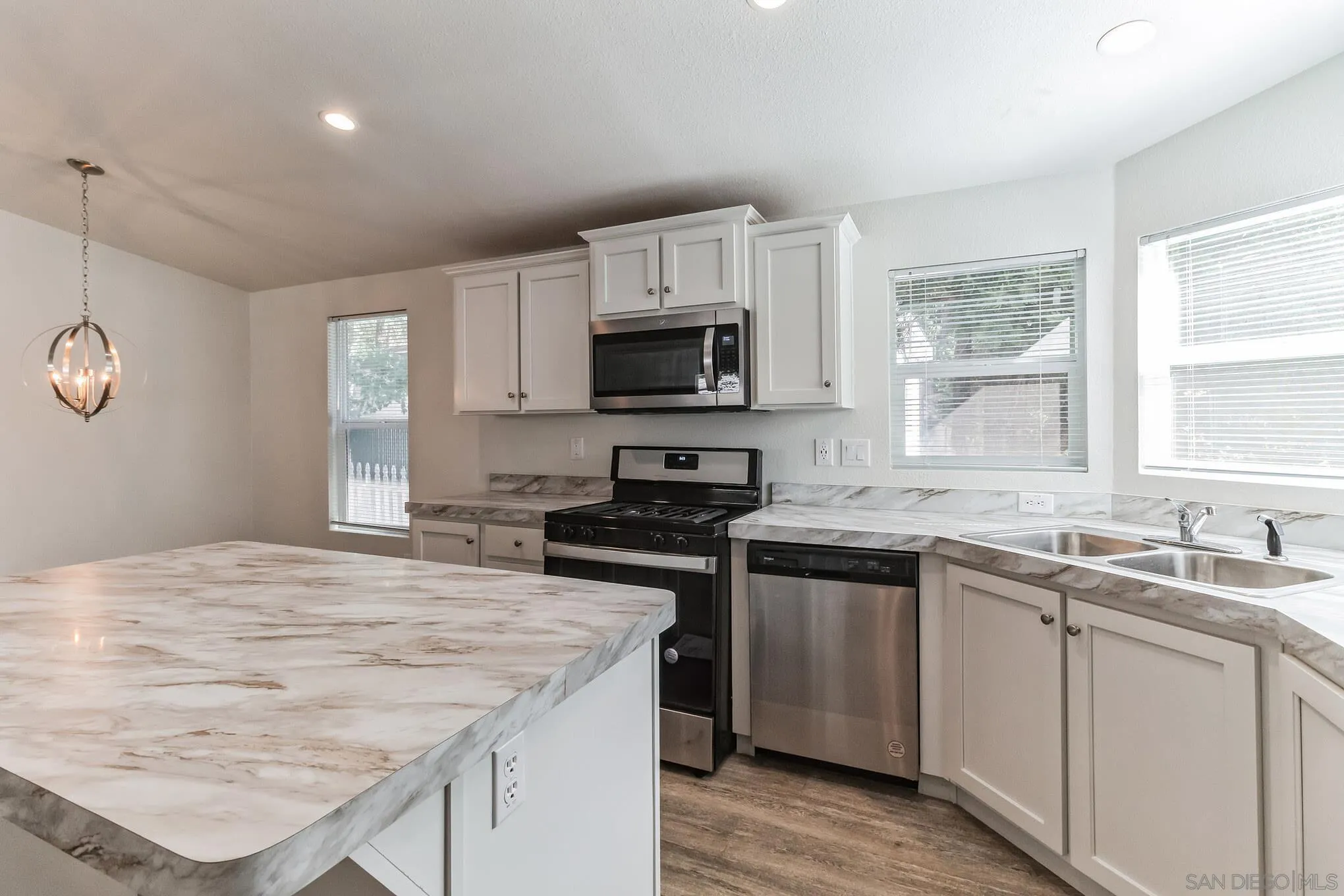 22899 Byron Road, Unit 35 Crestline, CA 92325 - Photo 2 of 18 a kitchen with a stove and a sink