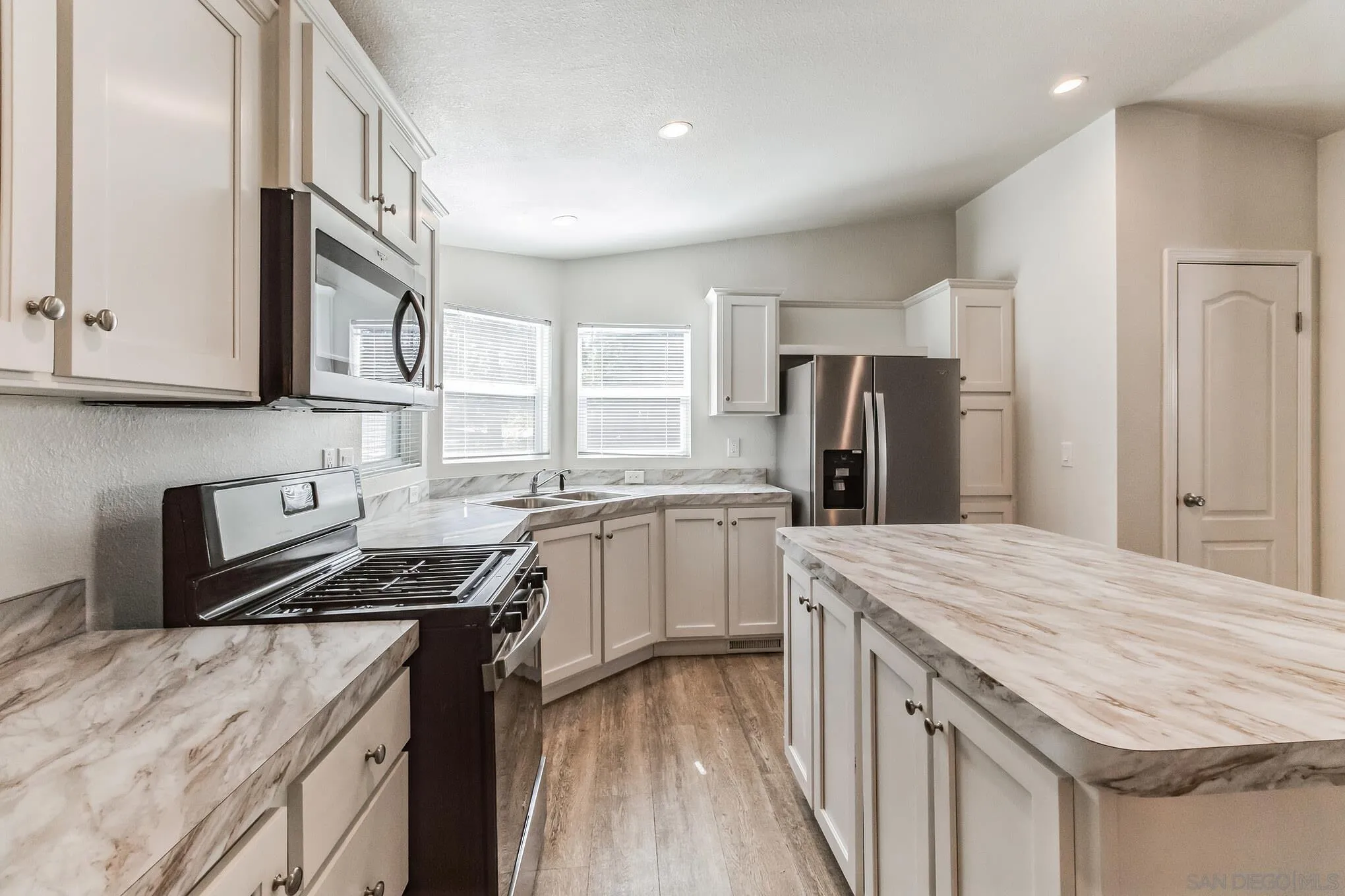 22899 Byron Road, Unit 35 Crestline, CA 92325 - Photo 3 of 18 a kitchen with a sink stove and refrigerator