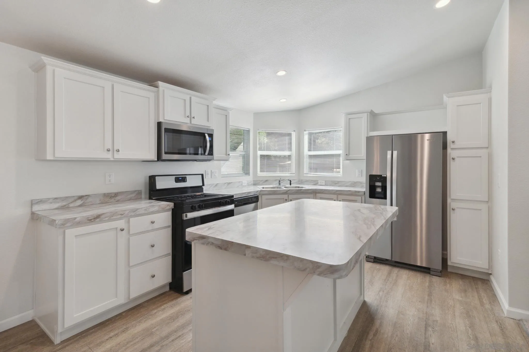 22899 Byron Road, Unit 35 Crestline, CA 92325 - Photo 6 of 18 a kitchen with stainless steel appliances granite countertop a sink stove and refrigerator