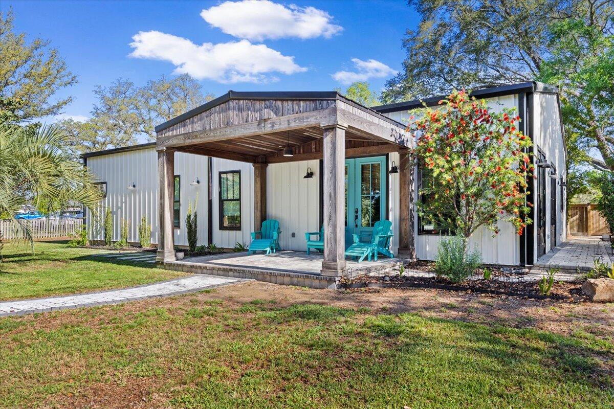 3574 Bob Tolbert Road Navarre, FL 32566 - Photo 2 of 67 a view of a house with backyard and trees