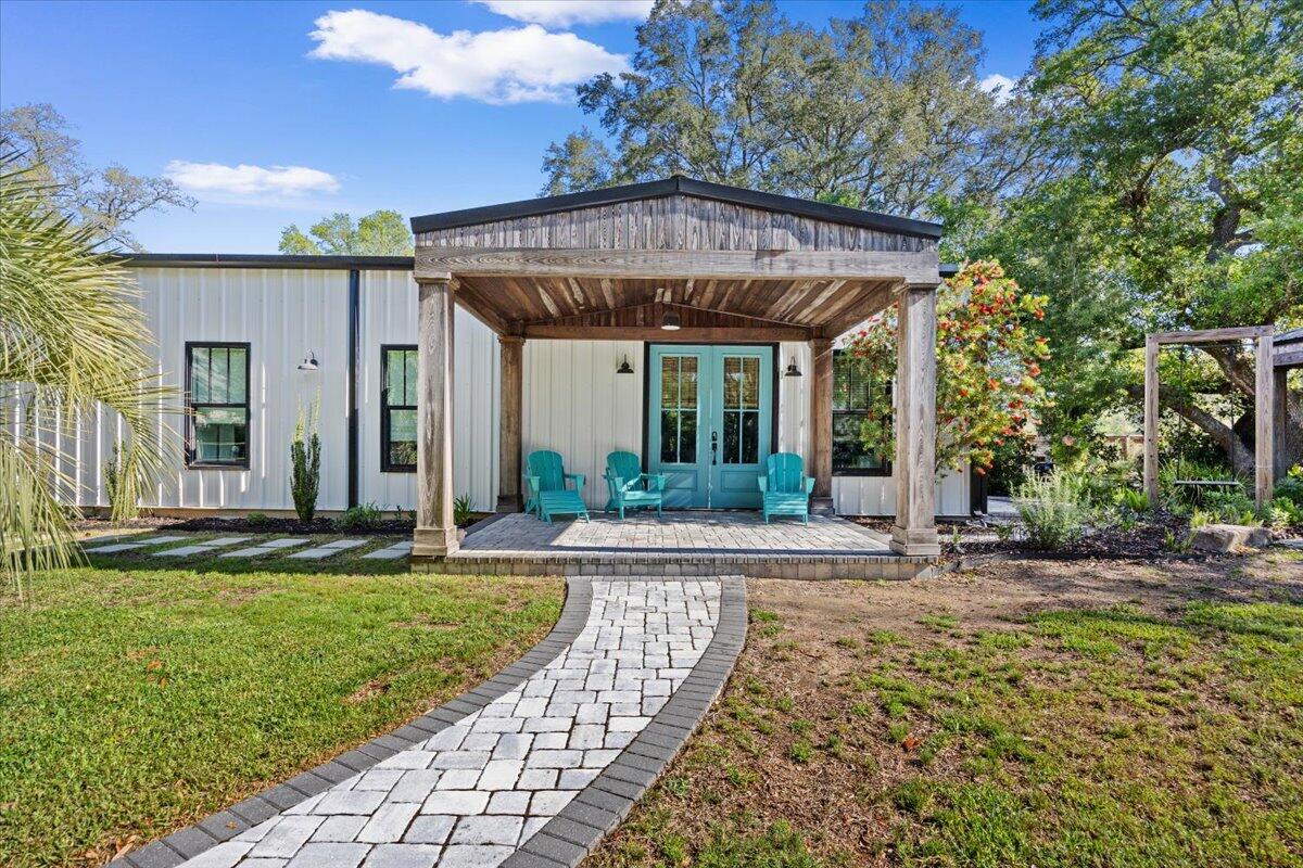 3574 Bob Tolbert Road Navarre, FL 32566 - Photo 3 of 67 a view of a house with backyard and sitting area