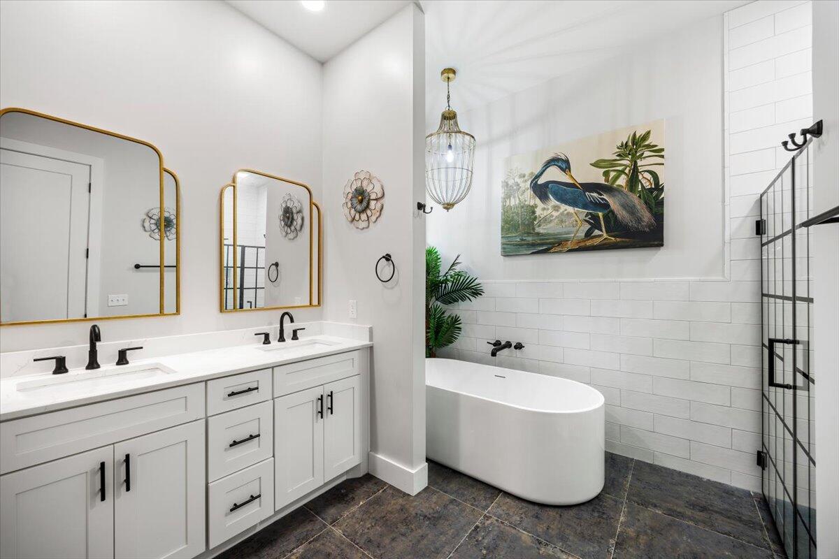 3574 Bob Tolbert Road Navarre, FL 32566 - Photo 35 of 67 a bathroom with a double vanity sink mirror and bathtub