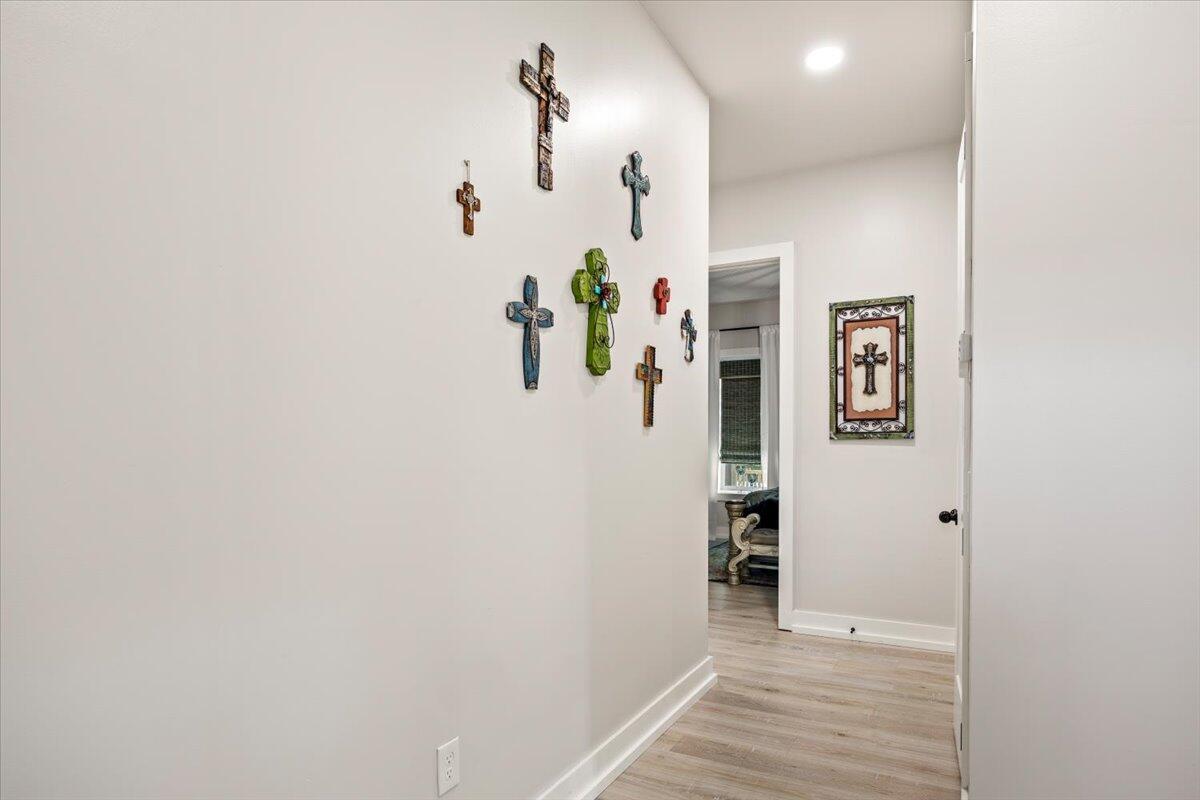 3574 Bob Tolbert Road Navarre, FL 32566 - Photo 36 of 67 a view of a hallway with wooden floor and closet