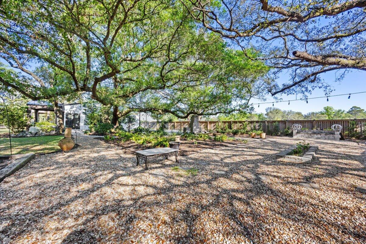 3574 Bob Tolbert Road Navarre, FL 32566 - Photo 43 of 67 a view of a yard with a tree