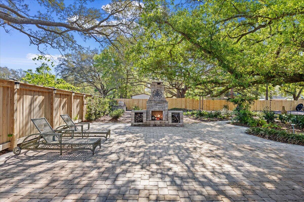 3574 Bob Tolbert Road Navarre, FL 32566 - Photo 45 of 67 a view of a house with backyard and sitting area