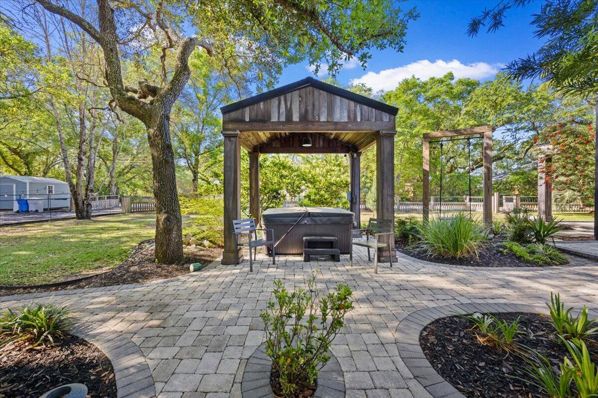 3574 Bob Tolbert Road Navarre, FL 32566 - Photo 47 of 67 a front view of a house with a yard table and chairs