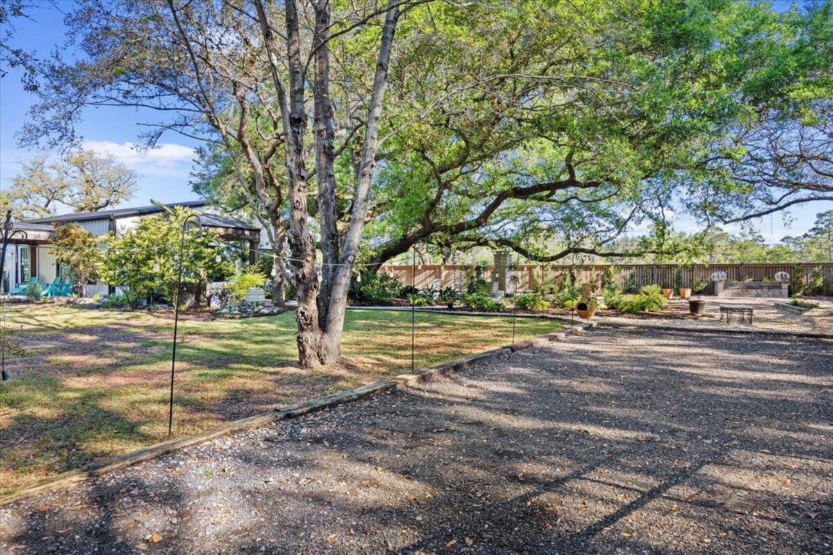3574 Bob Tolbert Road Navarre, FL 32566 - Photo 52 of 67 a view of a yard with large trees