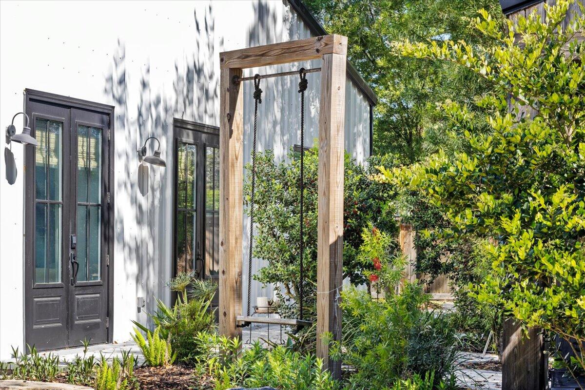 3574 Bob Tolbert Road Navarre, FL 32566 - Photo 54 of 67 a view of a glass door with a tree in front of it