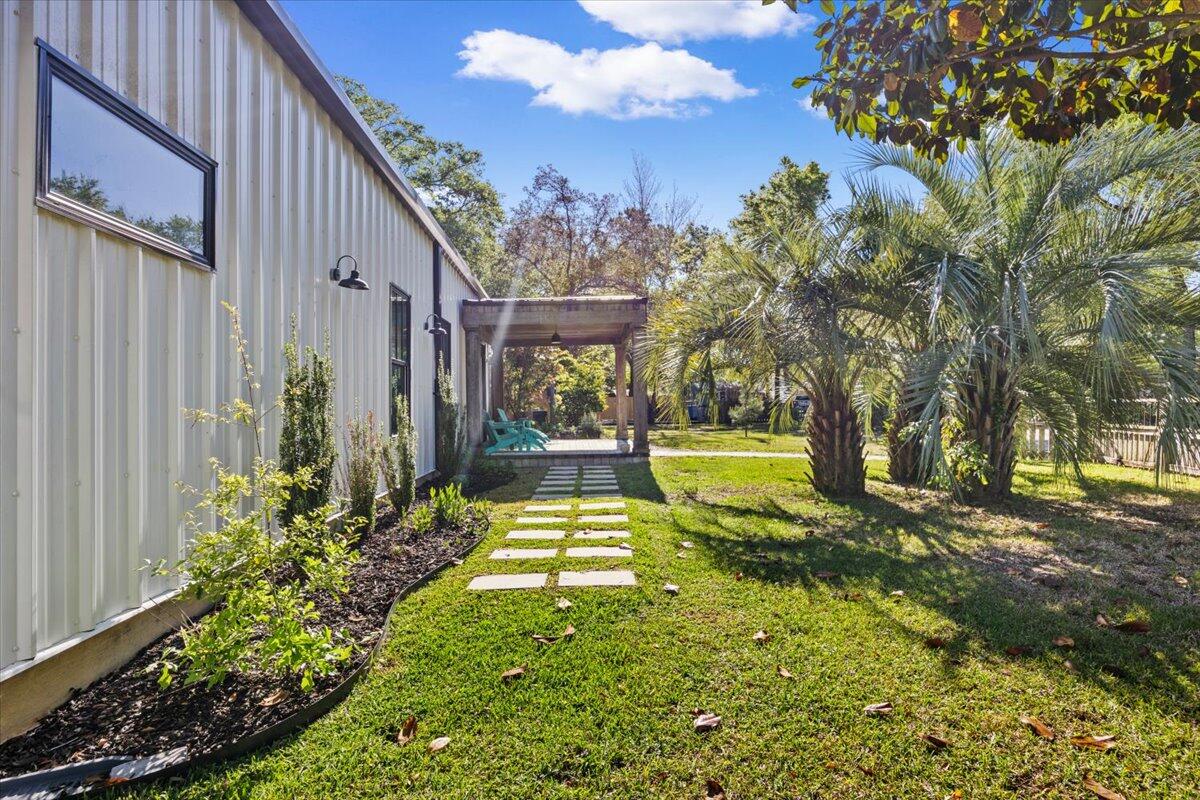 3574 Bob Tolbert Road Navarre, FL 32566 - Photo 58 of 67 a view of a backyard with plants and a garden