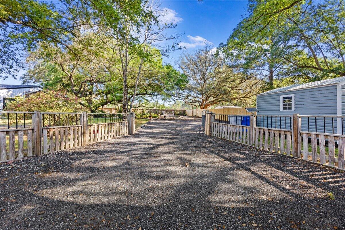 3574 Bob Tolbert Road Navarre, FL 32566 - Photo 66 of 67 a view of a yard with wooden fence