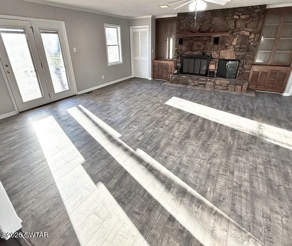 a view of a living room and a fireplace