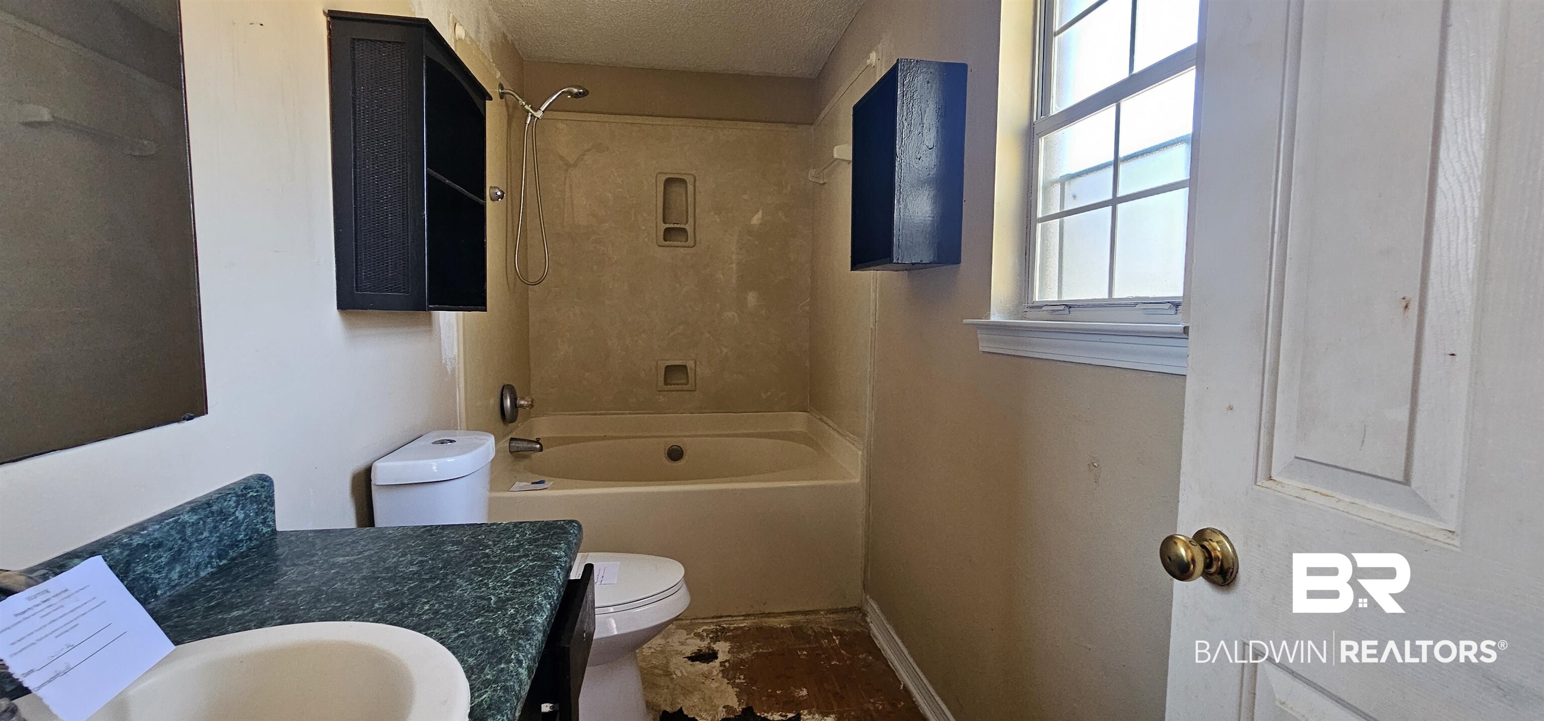 151 Bullard Street Atmore, AL 36502 - Photo 15 of 38 Full bath with vanity, tub / shower combination, and a textured ceiling