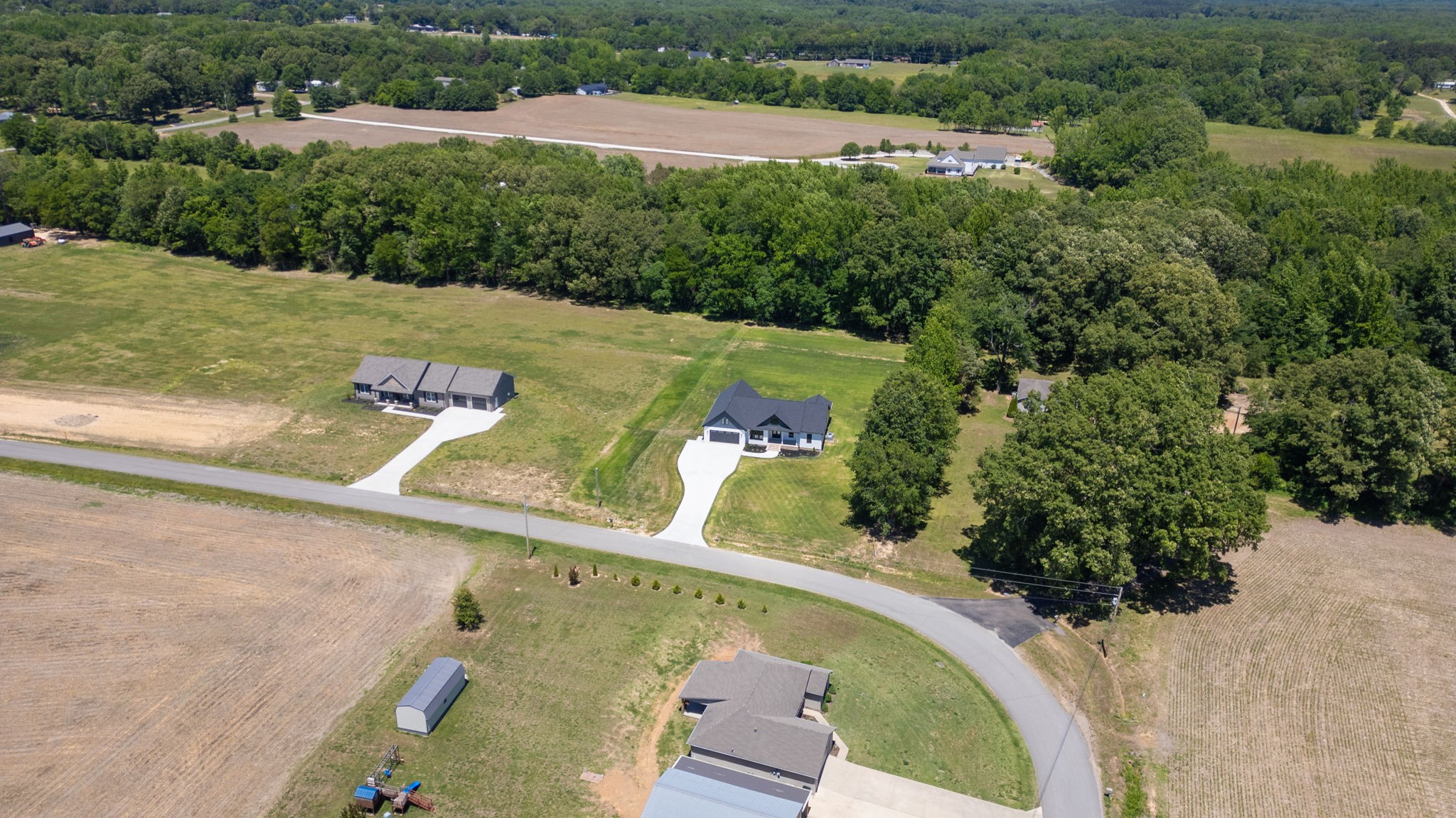 865 Alman Cemetery Road Paris, TN 38242 - Photo 40 of 41 an aerial view of a swimming pool with a yard
