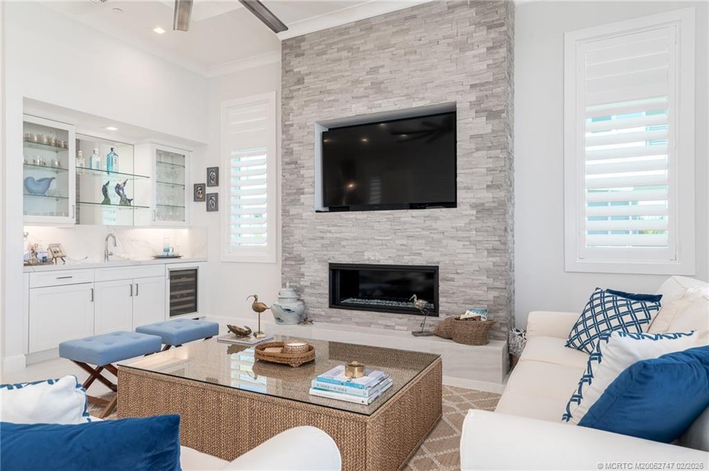 4824 Watersong Way Fort Pierce, FL 34949 - Photo 15 of 65 a living room with furniture and a fireplace