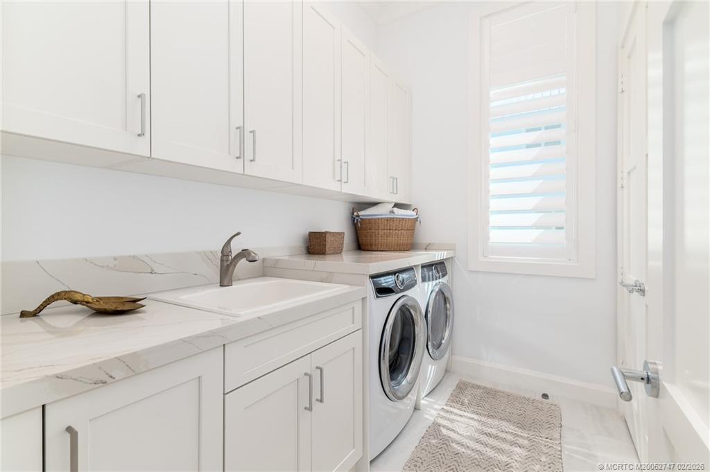 4824 Watersong Way Fort Pierce, FL 34949 - Photo 28 of 65 a utility room with sink dryer and washer