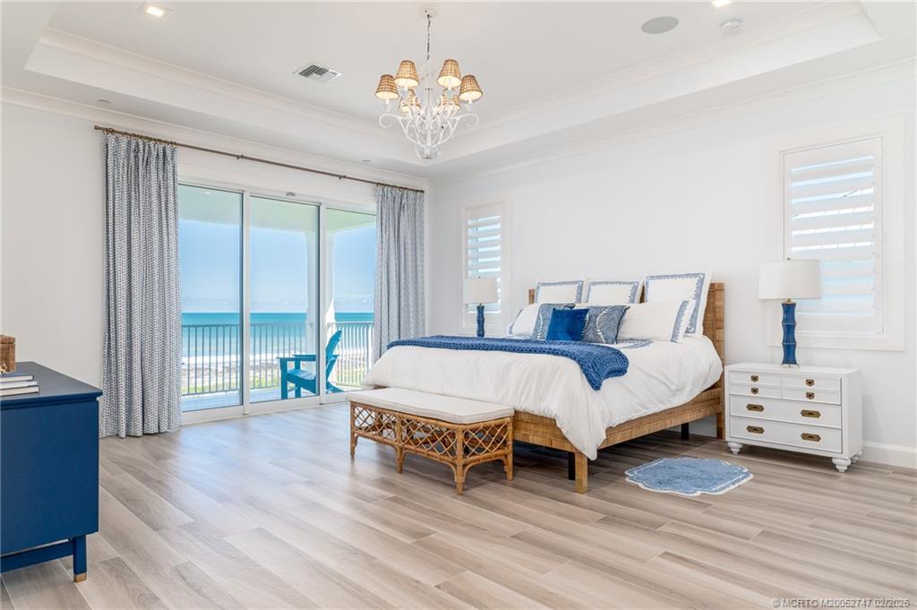 4824 Watersong Way Fort Pierce, FL 34949 - Photo 34 of 65 a spacious bedroom with a bed and a window