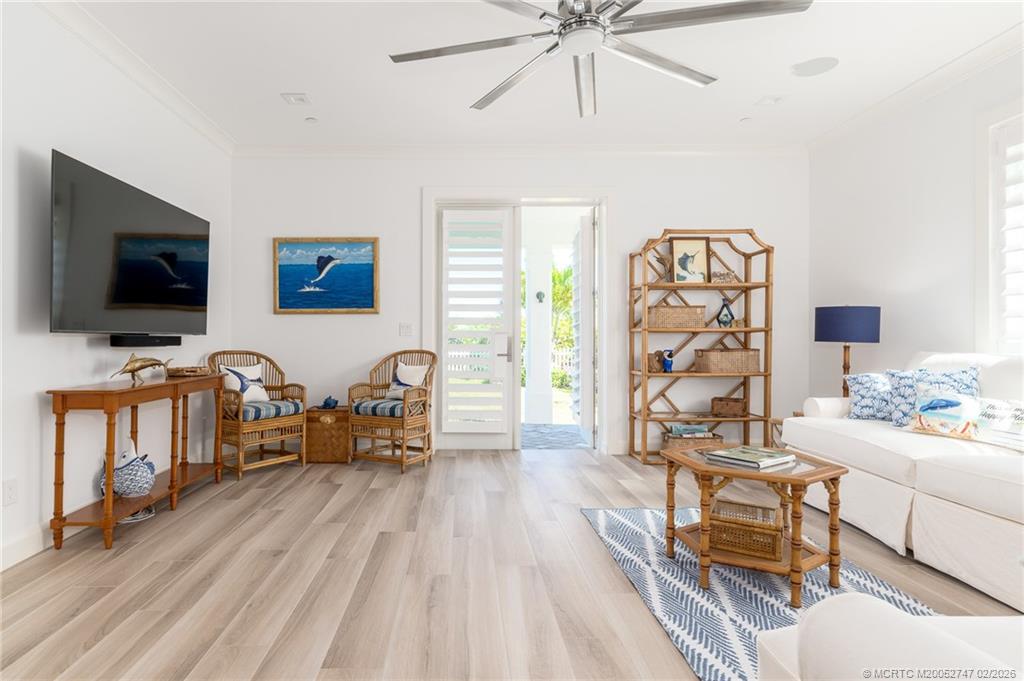 4824 Watersong Way Fort Pierce, FL 34949 - Photo 51 of 65 a living room with furniture and a flat screen tv