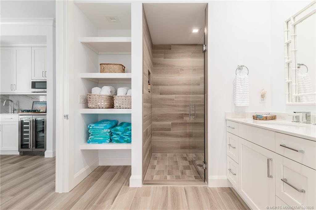 4824 Watersong Way Fort Pierce, FL 34949 - Photo 54 of 65 a bathroom with a sink and a shower