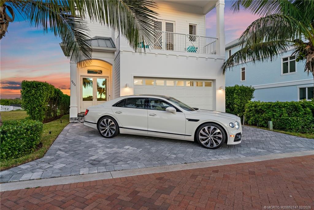 4824 Watersong Way Fort Pierce, FL 34949 - Photo 57 of 65 a car parked in front of a house