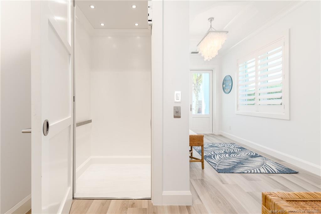 4824 Watersong Way Fort Pierce, FL 34949 - Photo 8 of 65 a bathroom with a glass shower door