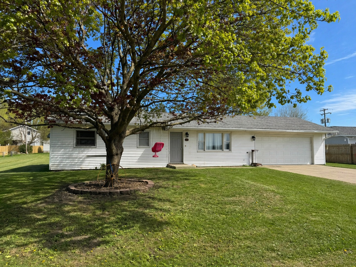 a house that has a tree in front of it