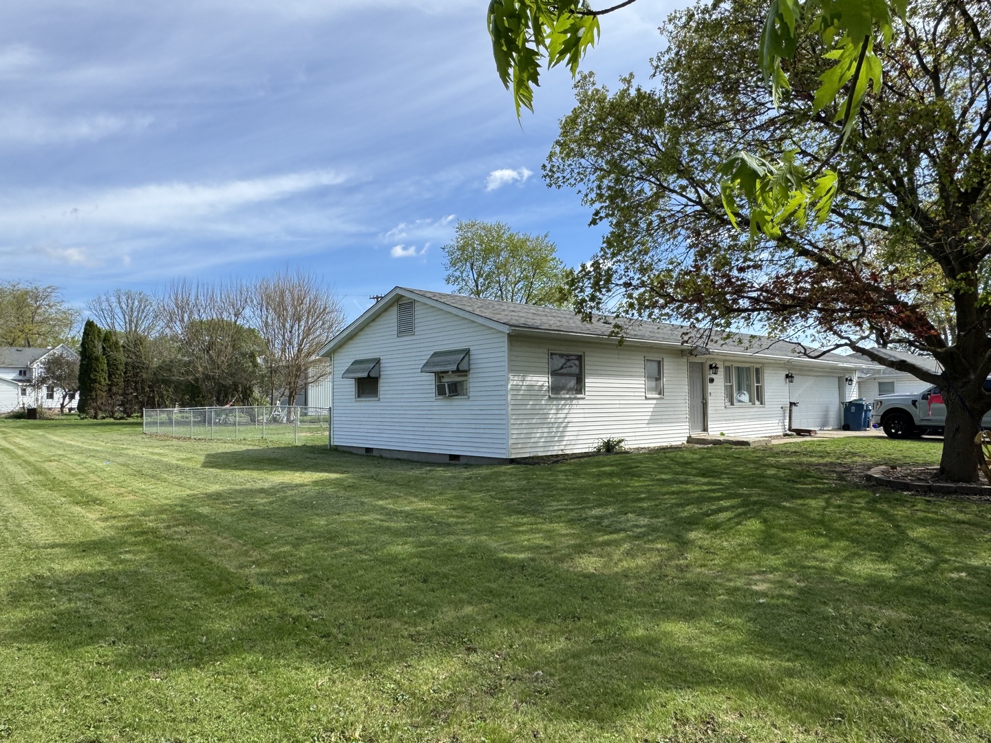 419 East Cleveland Street Cullom, IL 60929 - Photo 4 of 14 a house view with a garden space