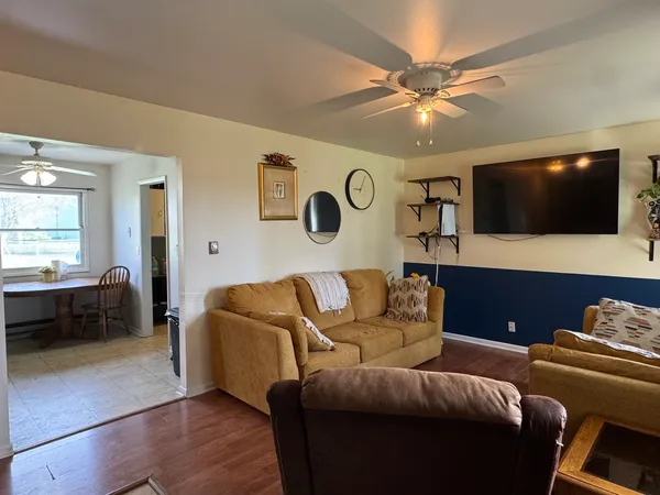 a living room with furniture and a flat screen tv