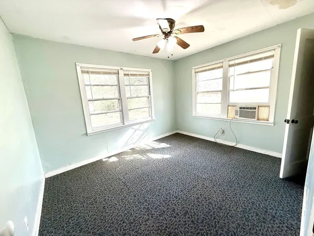 a view of a hallway view with wooden floor