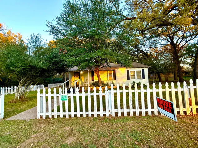 a view of a house with a small yard