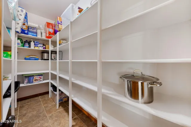a view of empty room with wooden floor and fireplace