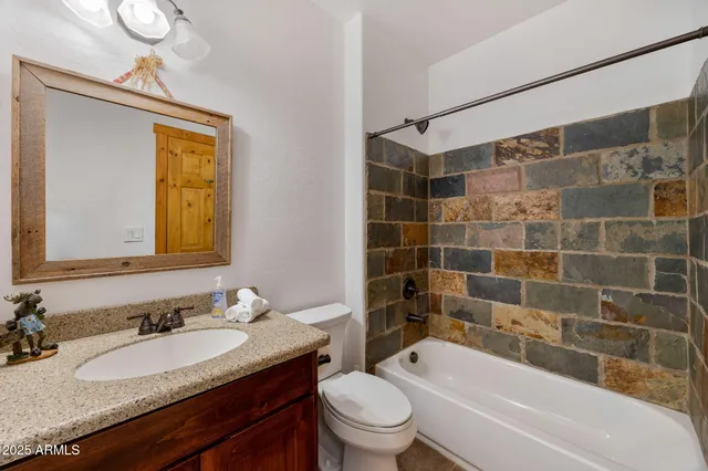 a kitchen with stainless steel appliances a stove microwave and refrigerator