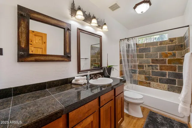 a bathroom with a tub and shower