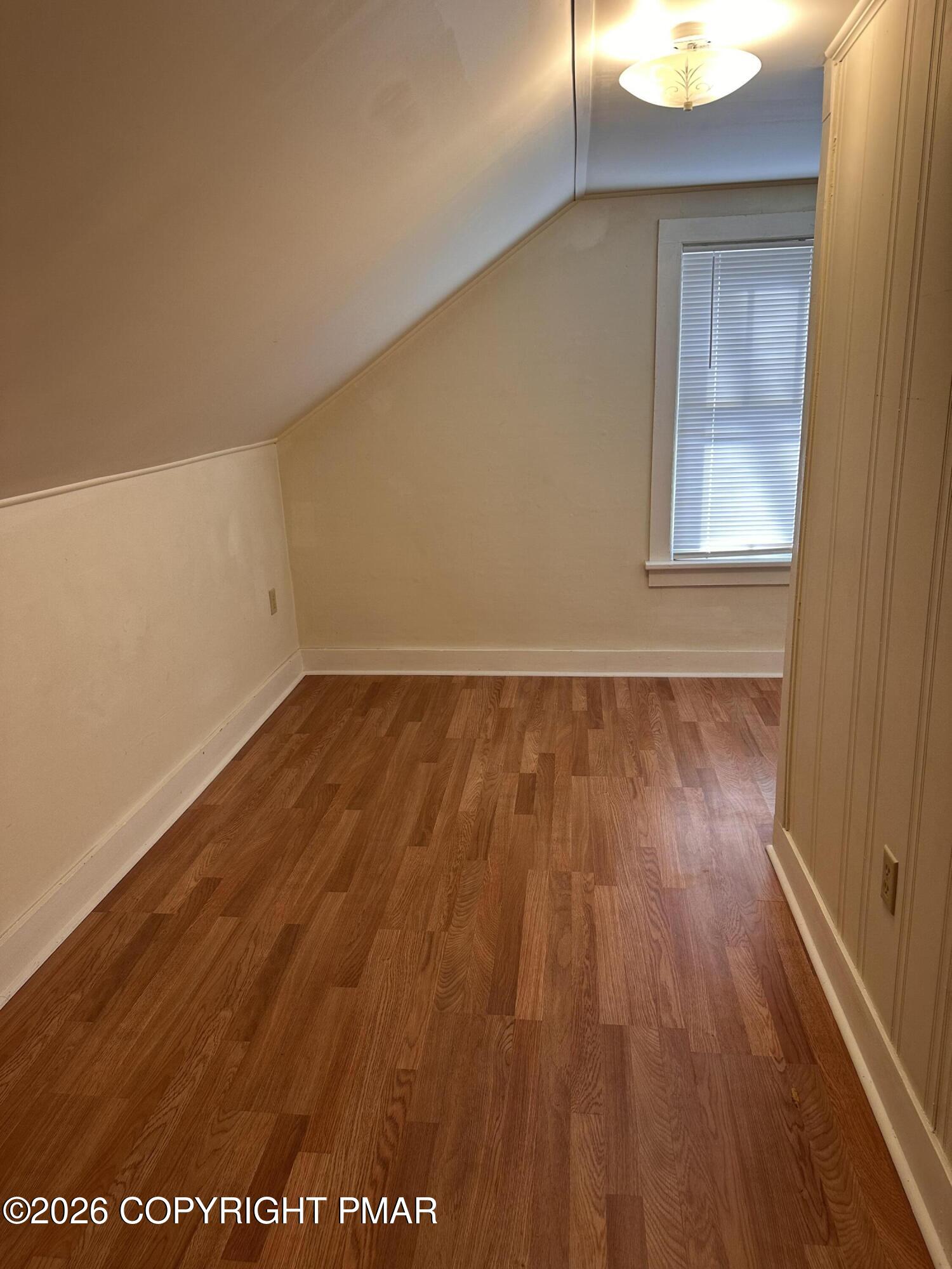 142 Craigs Meadow Road East Stroudsburg, PA 18301 - Photo 21 of 23 a view of an empty room with wooden floor and a window