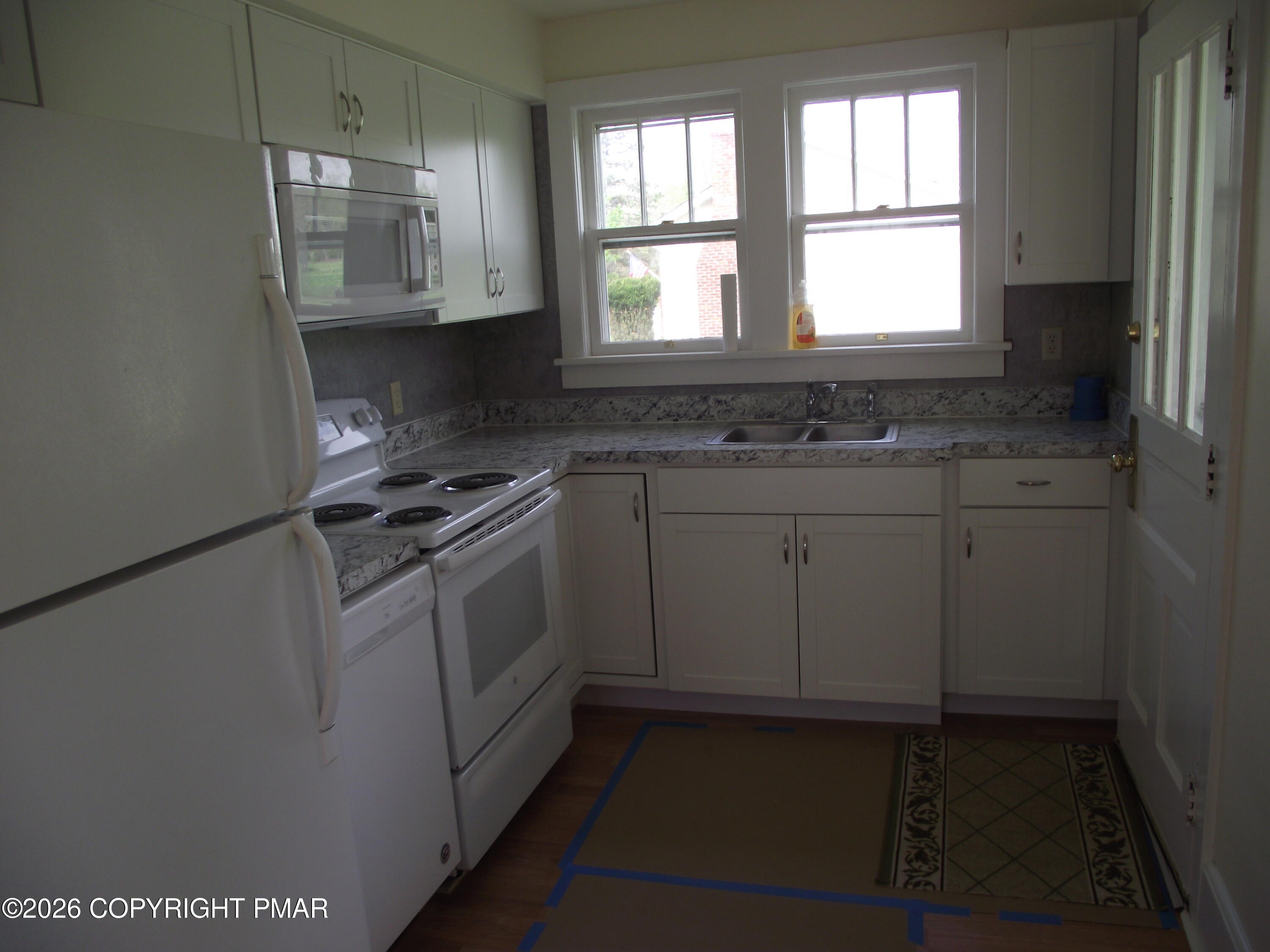 142 Craigs Meadow Road East Stroudsburg, PA 18301 - Photo 8 of 23 a kitchen with granite countertop white cabinets and white appliances