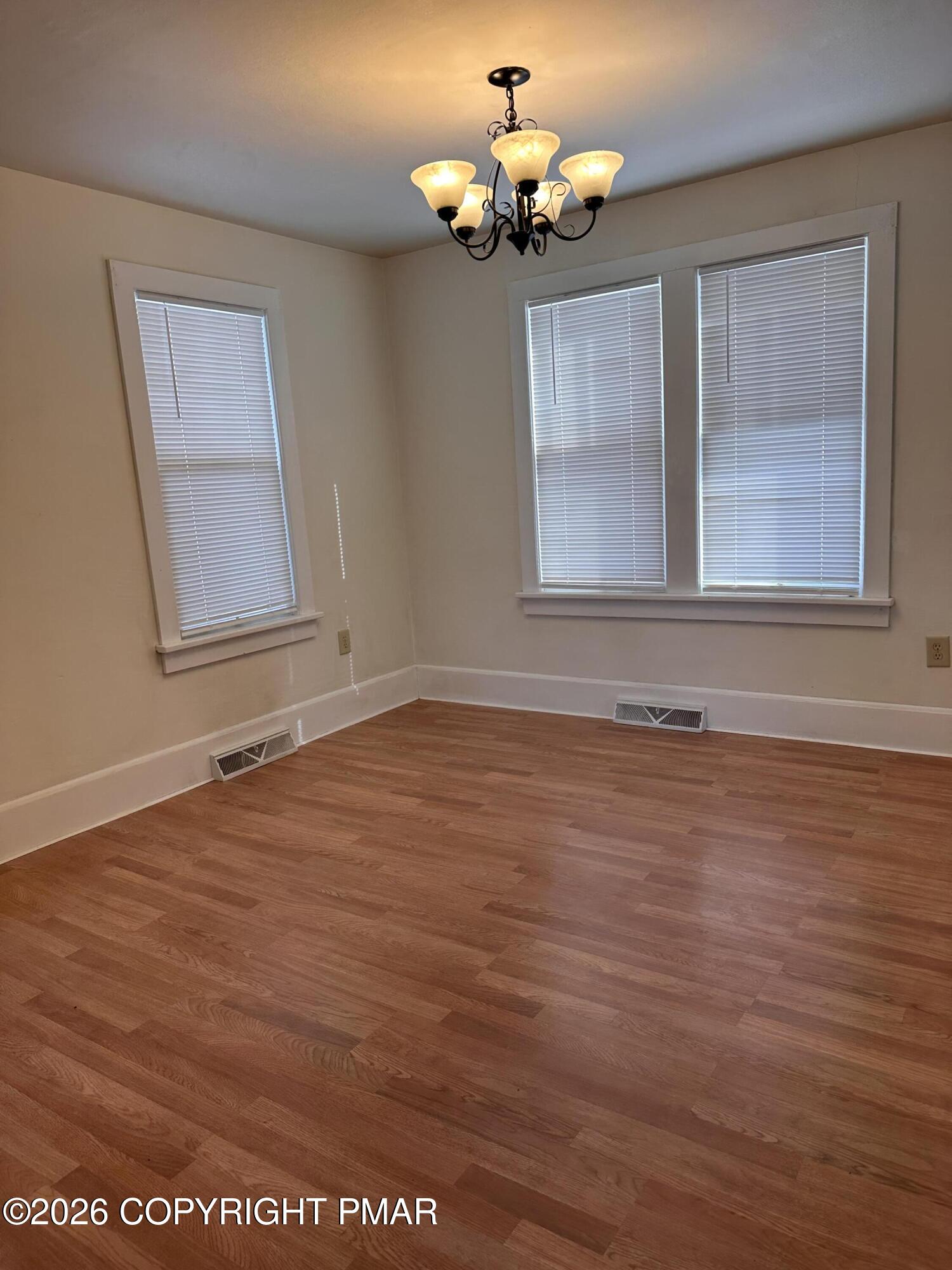 142 Craigs Meadow Road East Stroudsburg, PA 18301 - Photo 9 of 23 a view of an empty room with wooden floor and a window