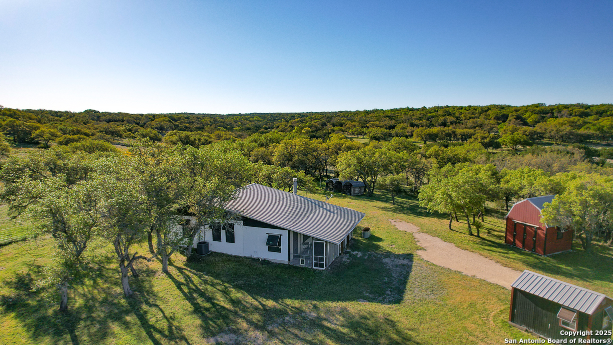 482 Wingert Road Junction, TX 76849 - Photo 13 of 61 a view of a yard with an outdoor seating