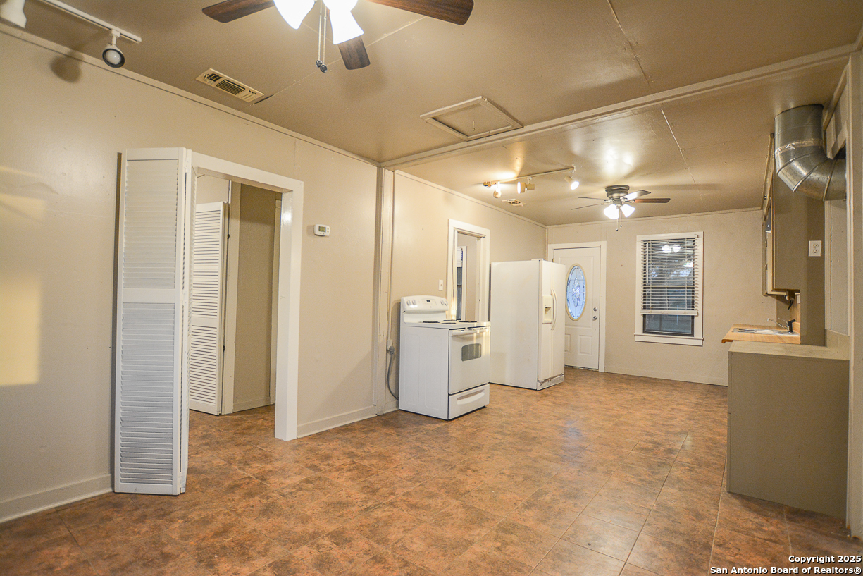 482 Wingert Road Junction, TX 76849 - Photo 16 of 61 a view of a hallway with chandelier and entryway
