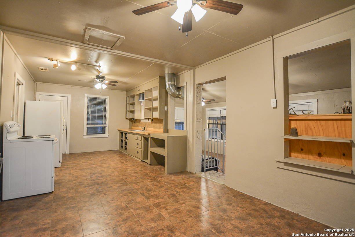 482 Wingert Road Junction, TX 76849 - Photo 17 of 61 a view of a kitchen with a sink and a refrigerator