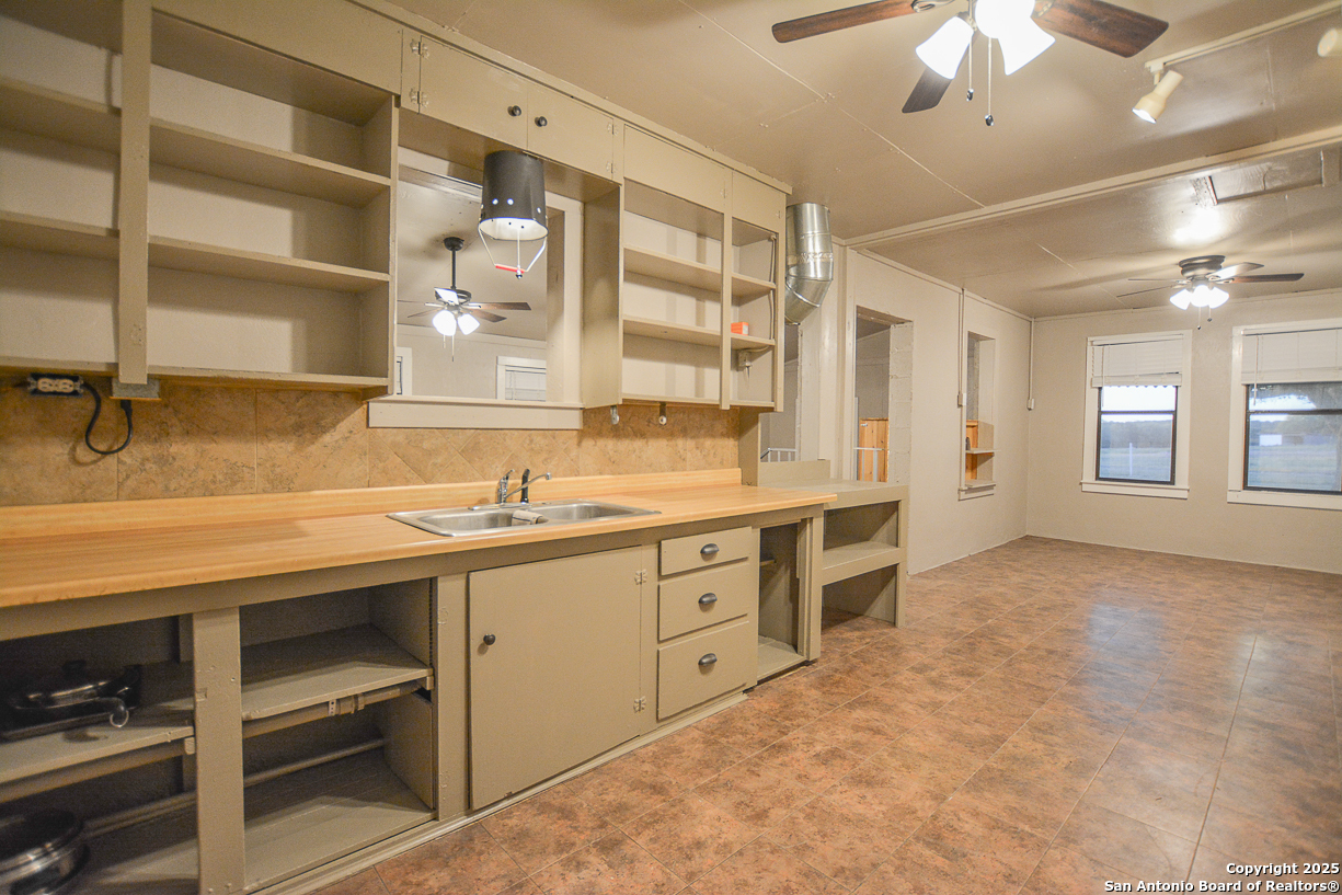 482 Wingert Road Junction, TX 76849 - Photo 18 of 61 a spacious bathroom with a granite countertop sink mirror and