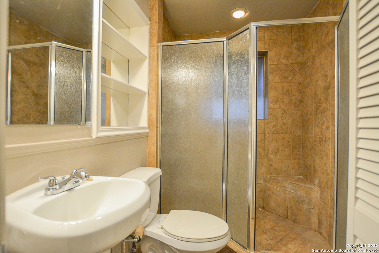 482 Wingert Road Junction, TX 76849 - Photo 21 of 61 a bathroom with a sink toilet and shower